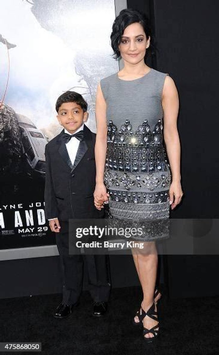 Archie Panjabi and son 063 at the San Andreas Premiere at the TCL