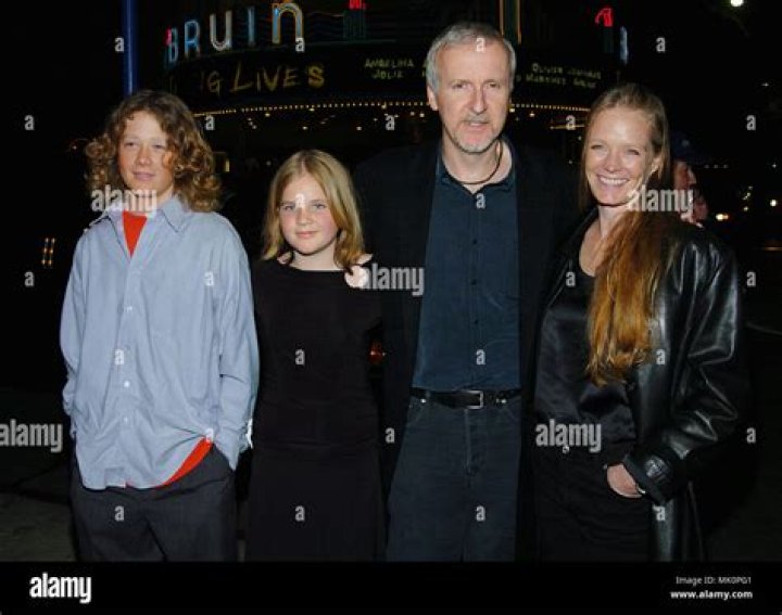 James Cameron with wife Suzy Amos and daughter and son arriving at the