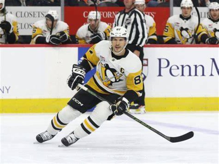 Sidney Crosby, NHL, Pittsburgh Penguins. He's so cute when holding that